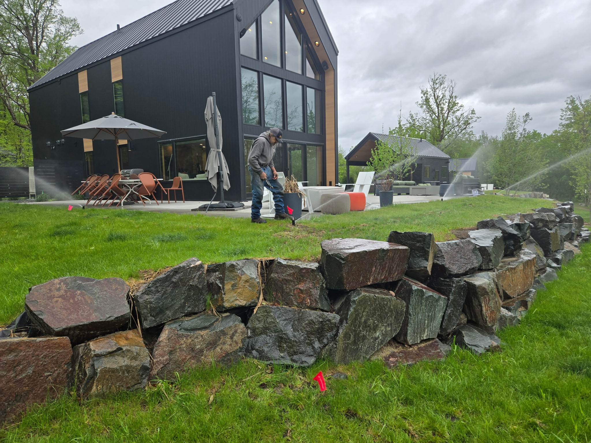 Sprinkler system running on a lush green Minnesota lawn — Image Irrigation North Branch MN